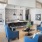 Resident lounge at Prose Columbus apartments in Columbus, GA, featuring wood grain floor paneling and counter seating.