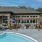 The pool area at Prose Columbus apartments for rent in Columbus, GA, featuring lounge chairs and umbrellas.